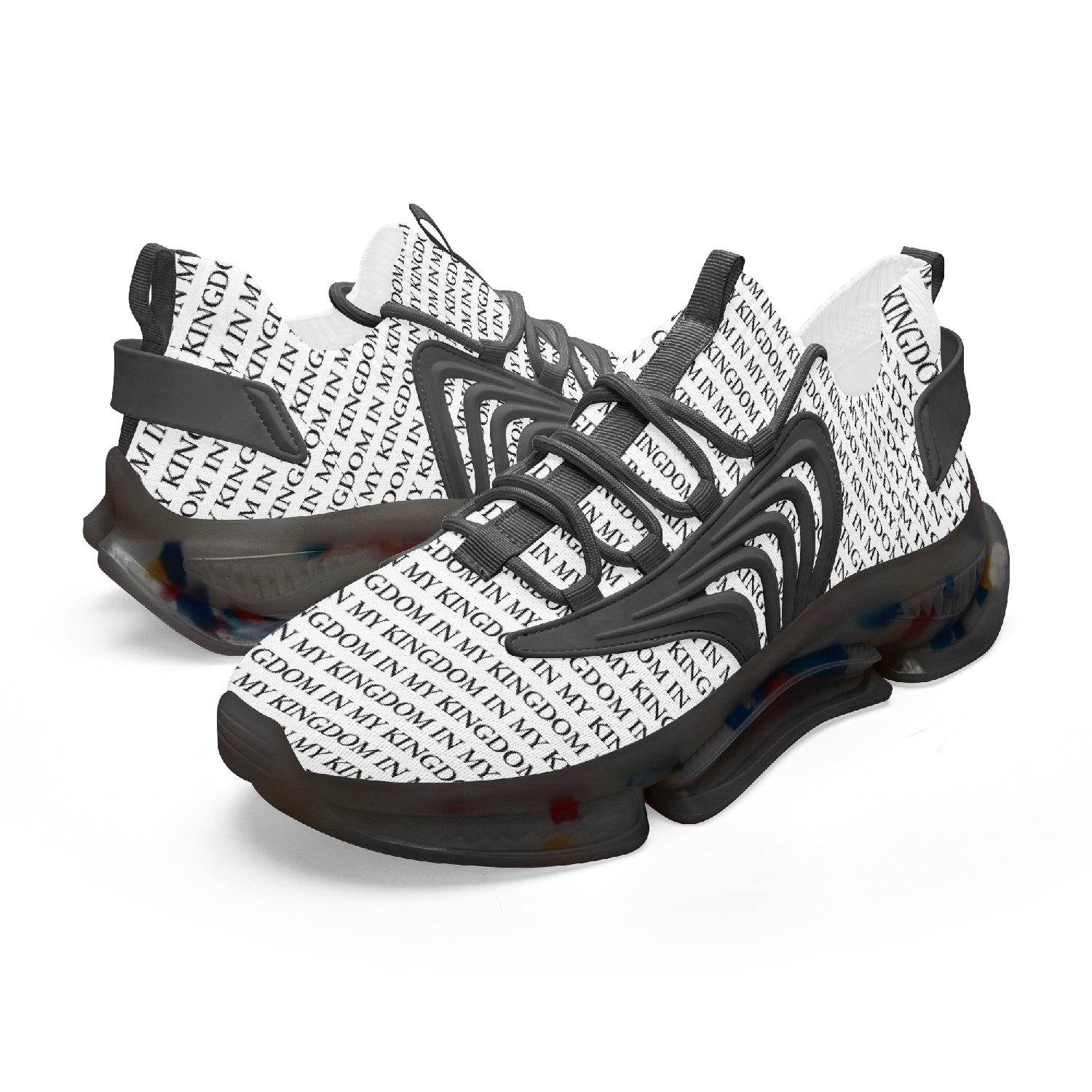 “In My Kingdom unisex performance runners featuring an all-over ‘IN MY KINGDOM’ monogram, sculpted futuristic midsole with coloured cushioning pods, wing-shaped side panels, and breathable mesh upper. Shown in both a white translucent sole version and a black translucent sole version.”