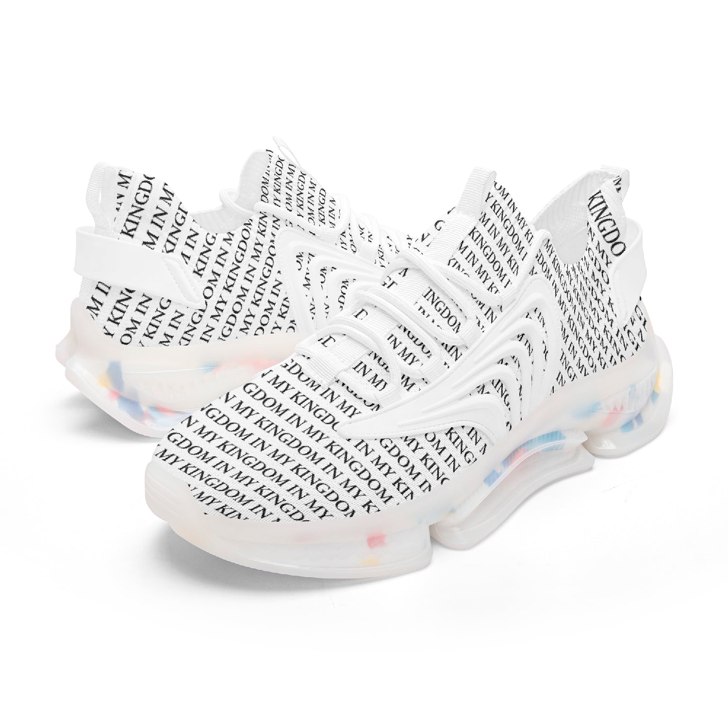 “In My Kingdom unisex performance runners featuring an all-over ‘IN MY KINGDOM’ monogram, sculpted futuristic midsole with coloured cushioning pods, wing-shaped side panels, and breathable mesh upper. Shown in both a white translucent sole version and a black translucent sole version.”
