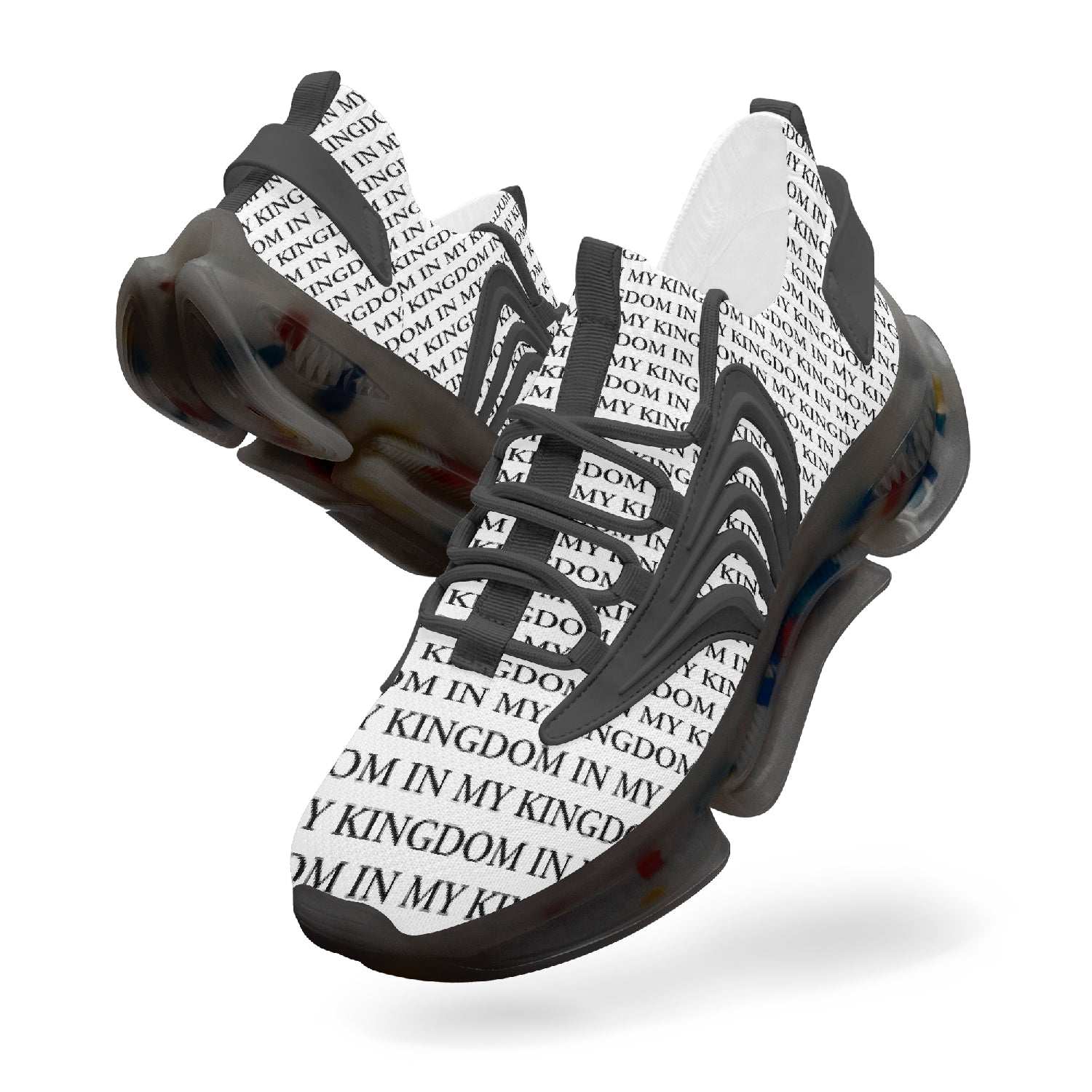 “In My Kingdom unisex performance runners featuring an all-over ‘IN MY KINGDOM’ monogram, sculpted futuristic midsole with coloured cushioning pods, wing-shaped side panels, and breathable mesh upper. Shown in both a white translucent sole version and a black translucent sole version.”